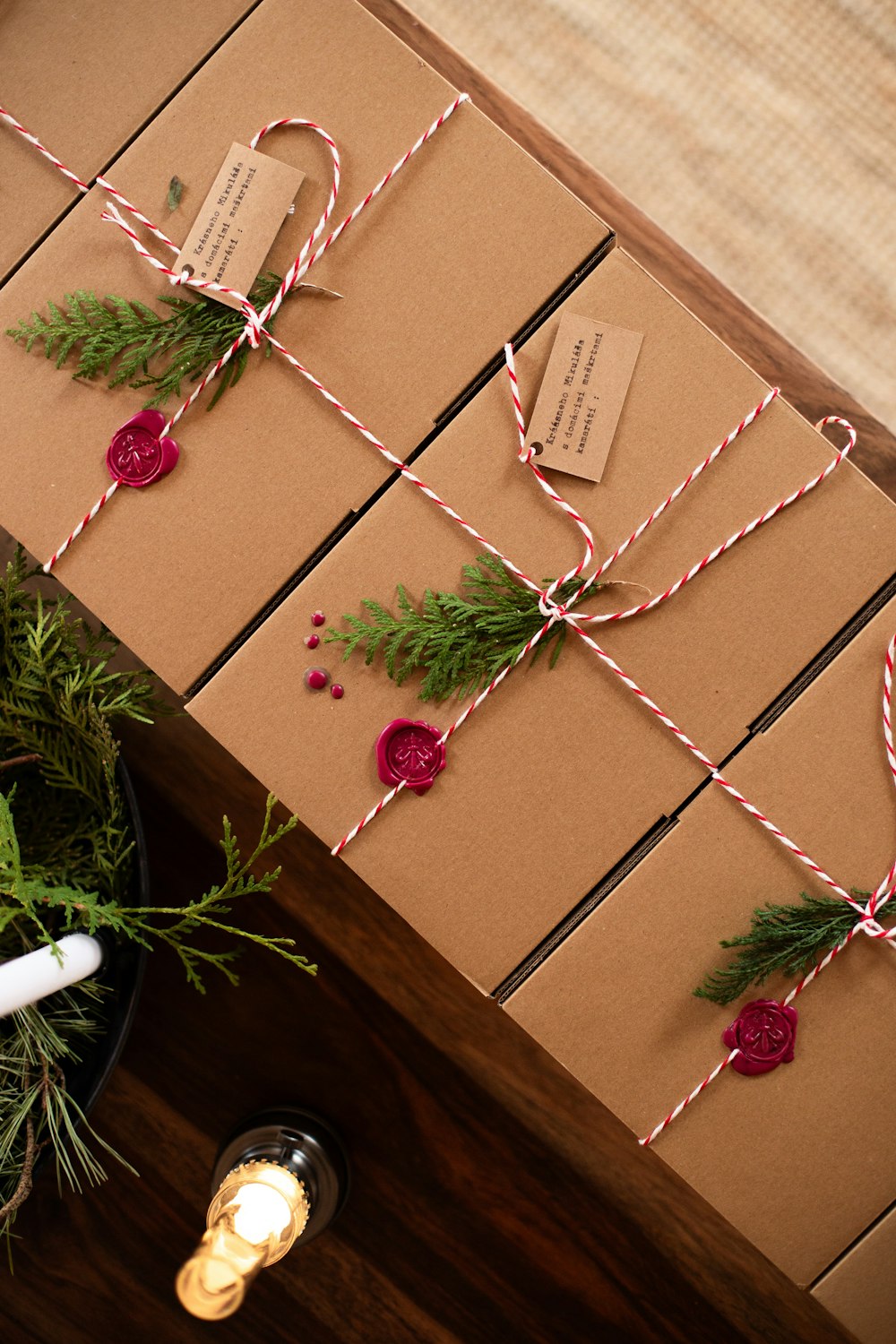 Brown kraft gift boxes tied with red and white twine