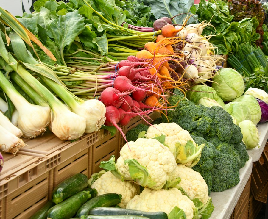 Fresh cauliflower, broccoli and vegetables at a market