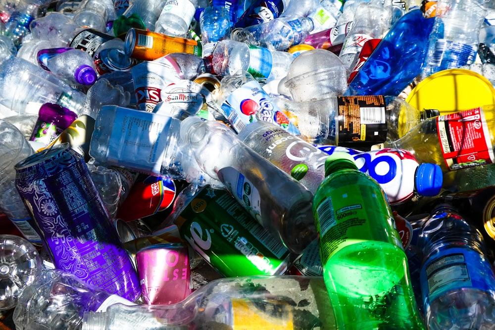 Large pile of discarded plastic bottles awaiting recycling