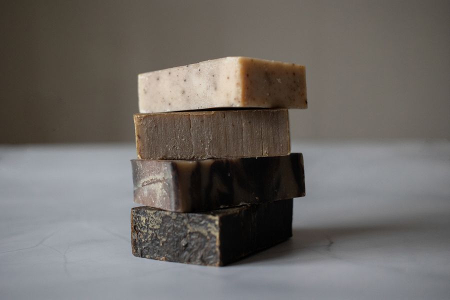 Stack of handmade natural soap bars on a table