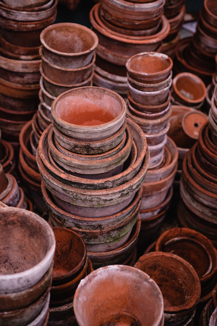 Stacks of handmade terracotta clay pots