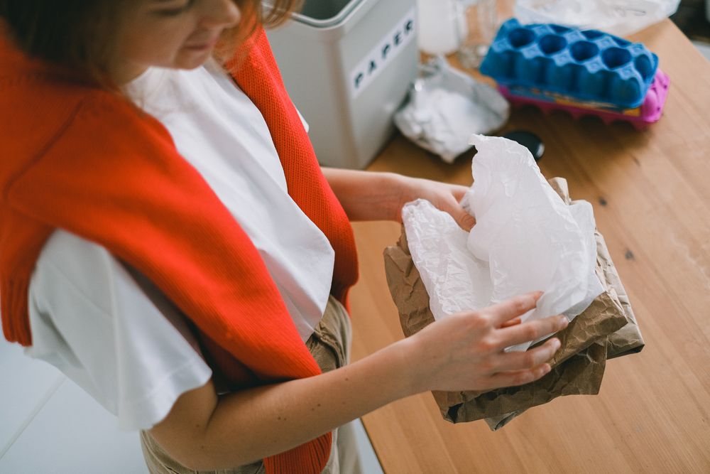 Woman sorting household waste at home