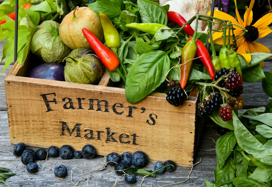 Wooden farmer's market crate filled with fresh local vegetables